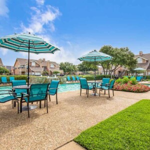 tables with umbrellas at the pool