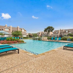 beautiful pool with lounge chairs